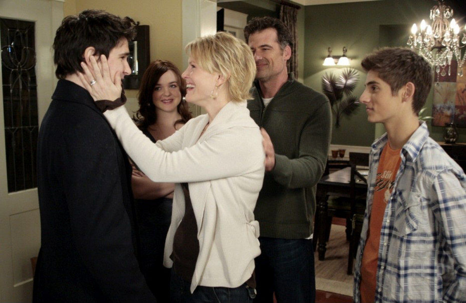 Kyle junto a la familia Trager