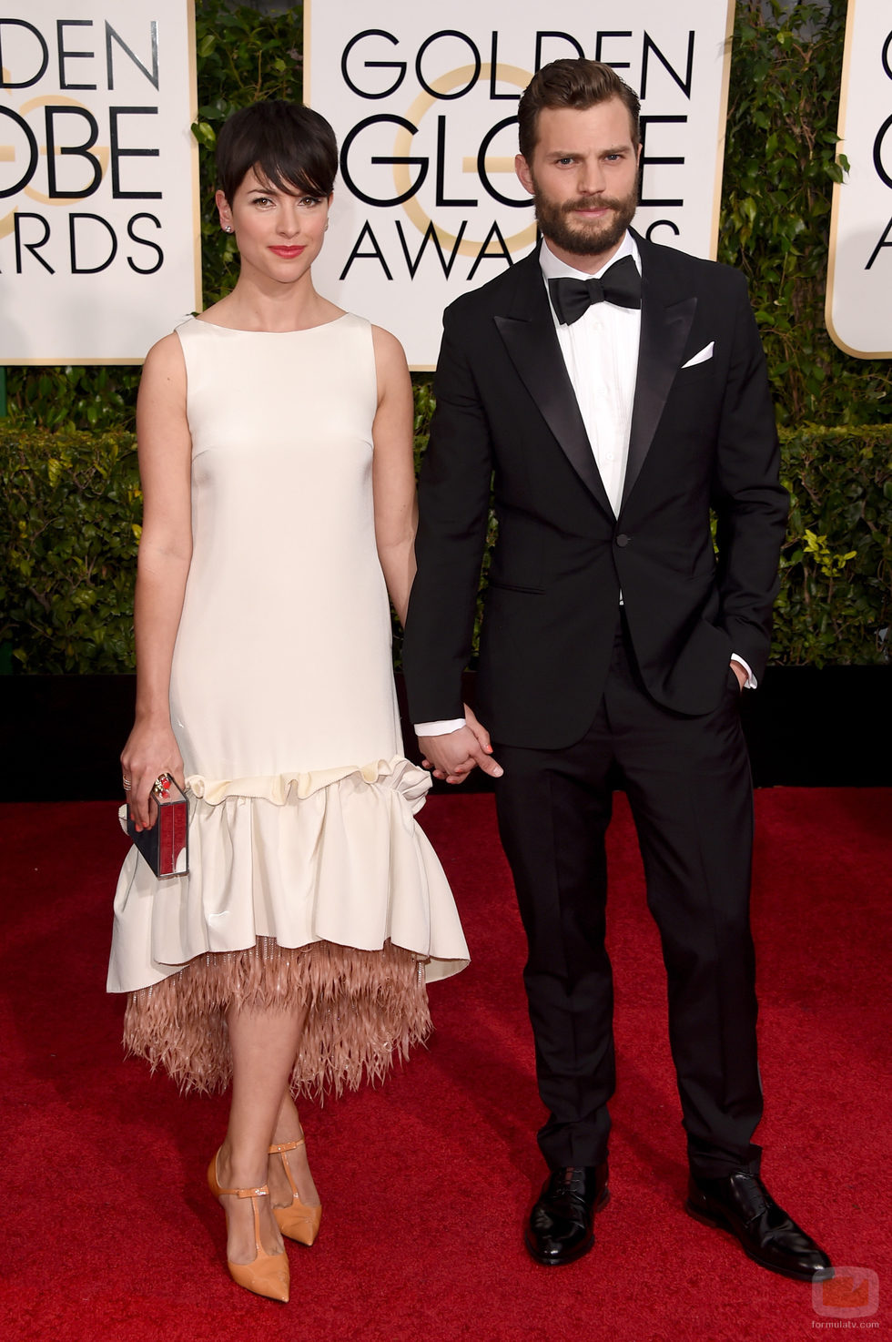 Jamie Dornan y Amelia Warner en los Globos de Oro 2015