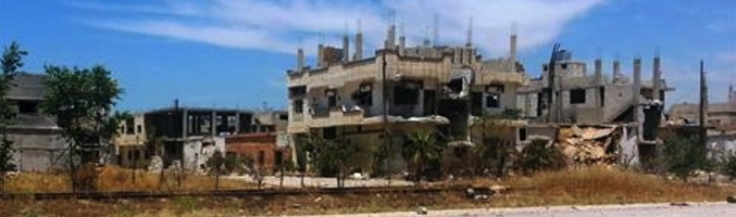 Edificios dañados por los bombardeos en la ciudad de Al Quseir en mayo de 2013. Fuente: Sarkis Kassargian - AFP