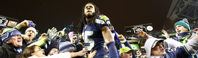 Jugadores e hinchas celebran la victoria de los Seattle Seawhaks en la NFC y su pase a la final