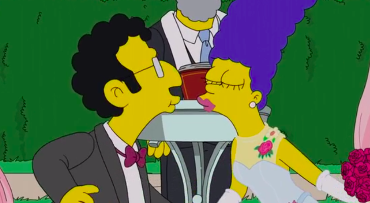 Artie a punto de besar a su esposa robótica en la boda